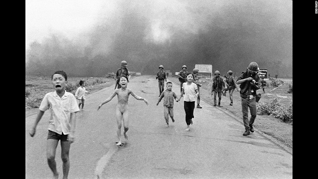 naked 10 year old girl screaming in agony with burns, running from Vietnam napalm attack
